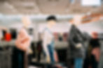 Three manequins dressed up in a retail store setting 